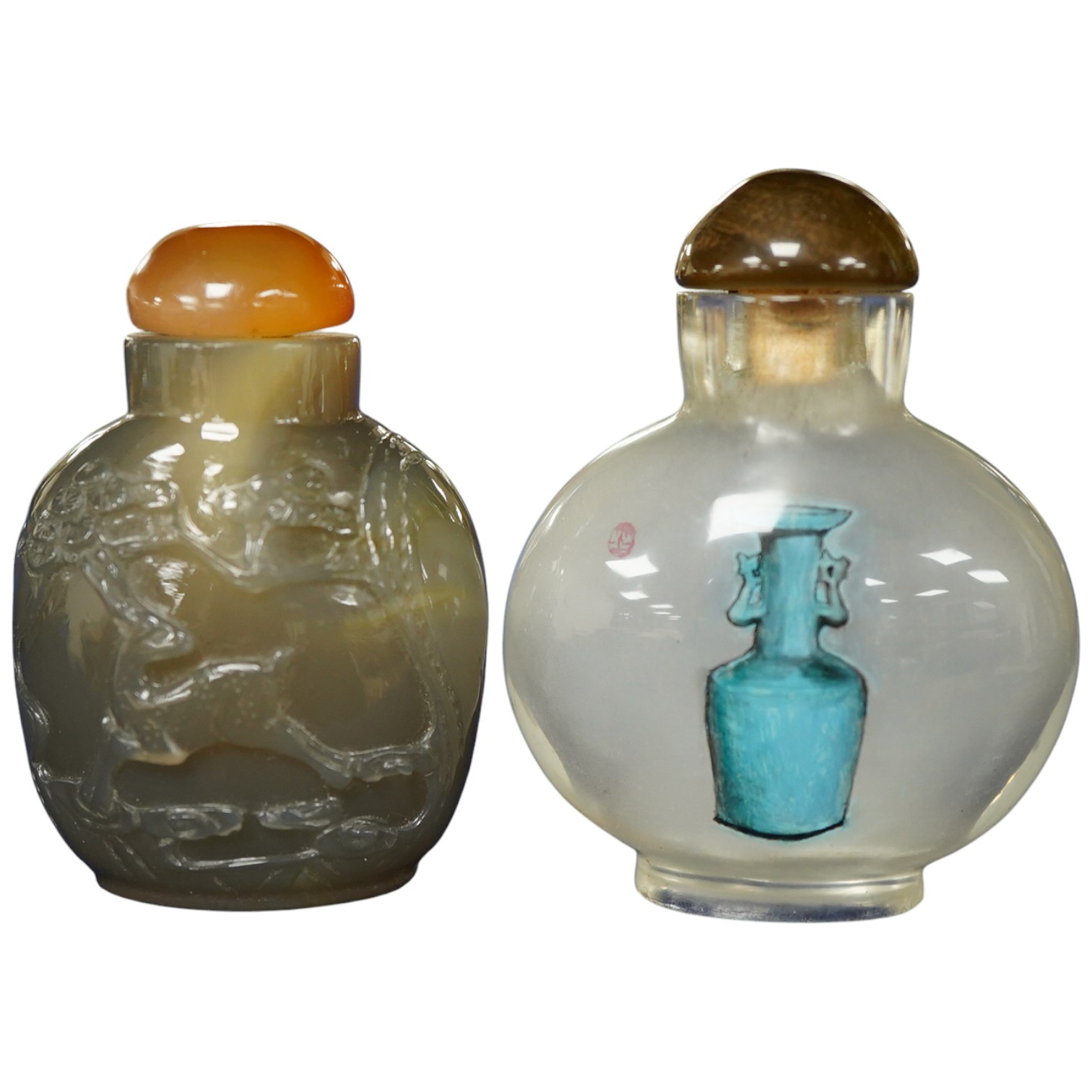 A Chinese carved agate snuff bottle and an inside painted snuff bottle, tallest 6cm